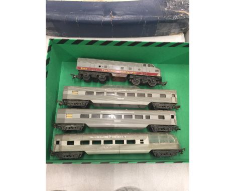 A TRI-ANG RAILWAYS CANADIAN PACIFIC ENGINE AND THREE CARRIAGES 