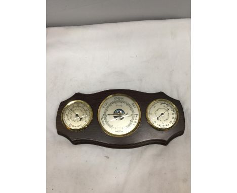 A FRAMED WOODEN WALL HANGING BAROMETER 