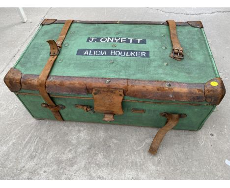 A TRAVEL TRUNK WITH LEATHER FITTINGS BY FINNIGAN'S, 18 NEW BOND STREET, LONDON, MANCHESTER AND LIVERPOOL 