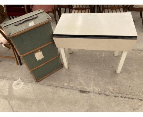 A FORMICA TOP DROP LEAF KITCHEN TABLE AND A TRAVELLING TRUNK 