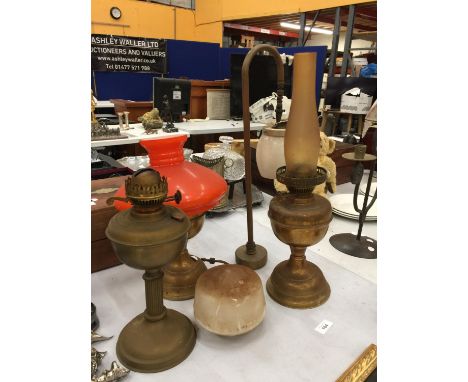 THREE BRASS OIL LAMPS - TWO MISSING CHIMNEYS PLUS A BRASS AND GLASS VERITAS LAMP 