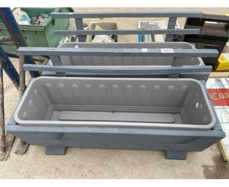 TWO WOODEN TROUGH PLANTERS WITH PLASTIC INSERTS 