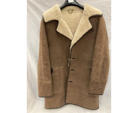 A BUTTON THROUGH SHEEPSKIN COAT, MADE IN SCOTLAND 