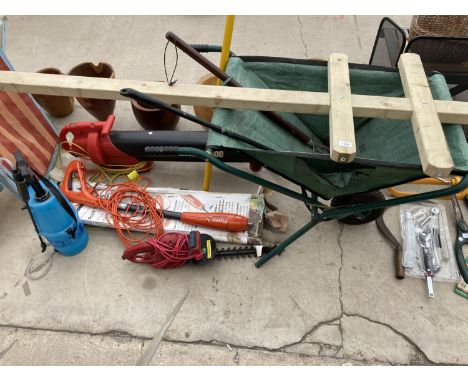 AN ASSORTMENT OF GARDEN ITEMS TO INCLUDE A FOLDING WHEEL BARROW, TOOLS AND A LEAF BLOWER ETC 