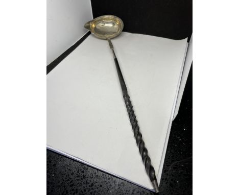 A MARKED SILVER LADLE WITH DECORATIVE HANDLE 