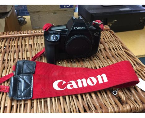 A VINTAGE CANON EOS 650 CAMERA WITH RED CANON STRAP 