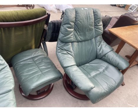 A GREEN STRESSLESS SWIVEL RECLINER AND STOOL 
