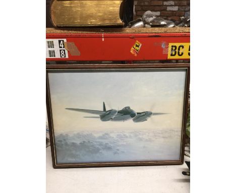 A FRAMED PRINT OF A MILITARY PLANE 