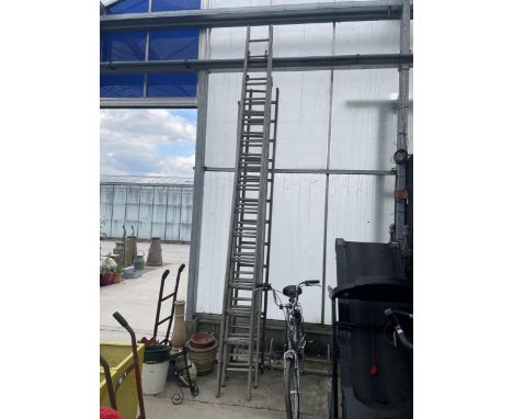 THREE SETS OF LADDERS TO INCLUDE 26 RUNG EXTENDING, 36 RUNG TRIPLE AND 12 RUNG WOODEN LADDER 