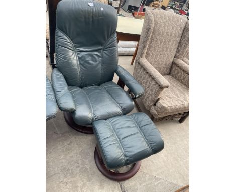 A GREEN STRESSLESS SWIVEL RECLINER AND STOOL 
