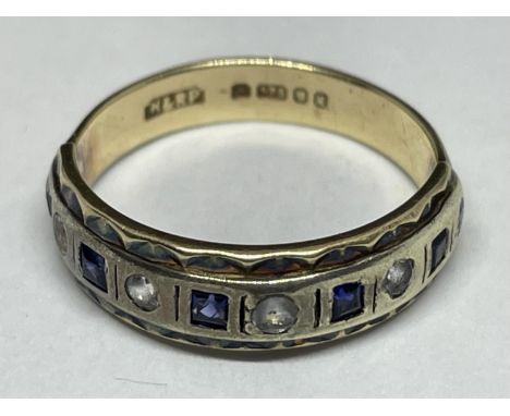 A 9 CARAT GOLD RING WITH FIVE SQUARE SAPPHIRES AND FIVE CLEAR STONES IN A BAND SIZE K 