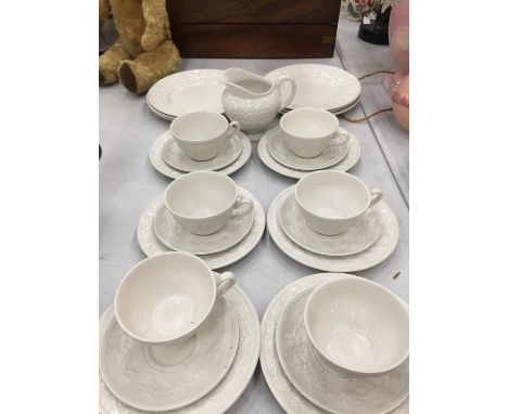 A QUANTITY OF WEDGWOOD 'FESTIVITY' EMBOSSED CUPS, SAUCERS, SIDE PLATES, BOWLS, JUG, ETC 