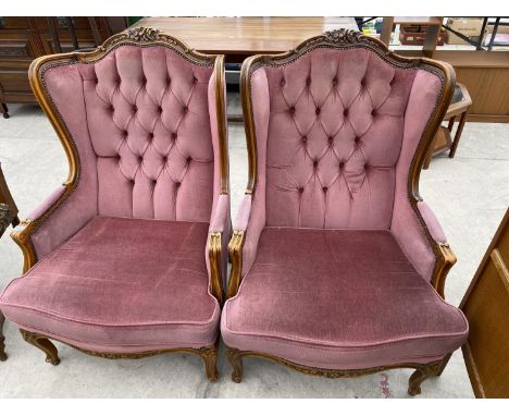 A PAIR OF CONTINENTAL BUTTON BACK WINGED EASY CHAIRS 