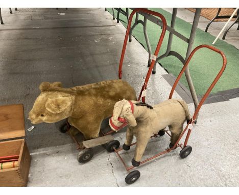 TWO VINTAGE PUSH/RIDE ON TOYS WITH WHEELS, ONE A DONKEY, THE OTHER A BEAR IN WELL LOVED CONDITION 