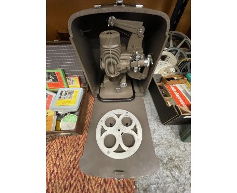 A BOXED BELL &amp; HOWELL MODEL 613 PROJECTOR IN CASE 