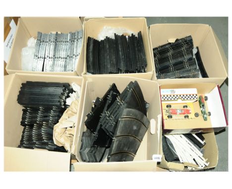 Scalextric a large group of Super 124 track including straights, bends, railings and others. Also in this lot is a boxed Supe