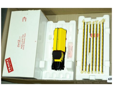 A Danbury Mint boxed 1938 Coca Cola Delivery Truck which comes complete with some Tools along with what appears to be a full 