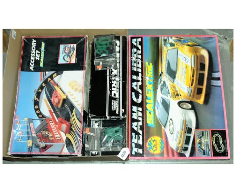 Scalextric - a boxed group of sets and accessories which includes a C.899 "Team Calibra Set" and others. Contents have not be