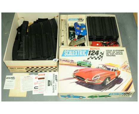 Scalextric a boxed (Super 124) Set 200 set including 3x cars, track, hand throttles, instructions and others. See picture for