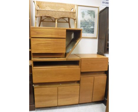 A collection of Tapley 33 teak cupboards, shelving units etc together with a modern pine shelf unit and a child's wicker sett