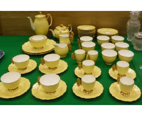 An Aynsley "Butterfly" pattern tea / coffee set comprising twelve teacups and saucers, six coffee cups and saucers, twelve si