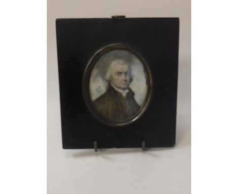 18TH CENTURY ENGLISH SCHOOL "Gentleman in Brown Coat and Grey Wig", portrait miniature on ivory, in ebonised frame