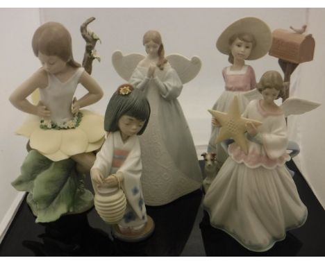 A collection of Lladro figures including "Angel", "Flower Fairy", "Oriental Lantern", "Waiting for your Letter" and "Angel wi