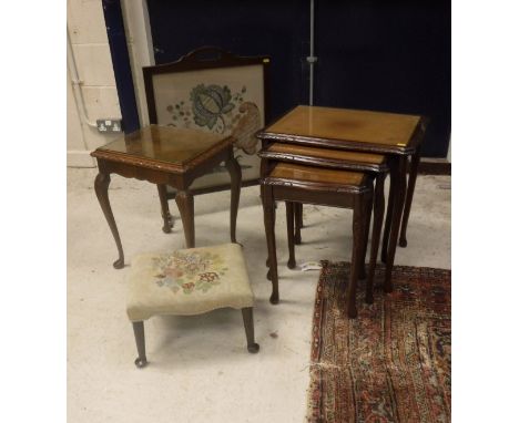 A late 19th Century mahogany framed footstool with tapestry work seat and shaped frieze in turned legs to pad feet together w