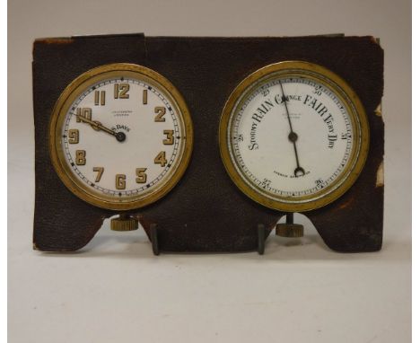 An early 20th Century travelling barometer and clock face for J.C. Vickery of London (case missing), the white enamel dial se
