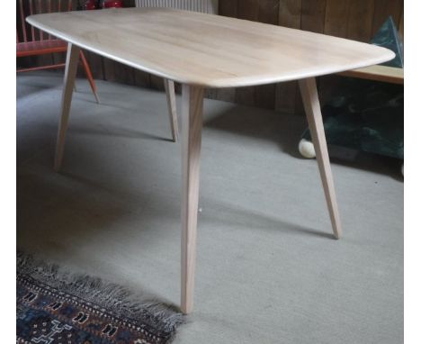 An Ercol beech plank table on square tapering splayed legs  CONDITION REPORTS Light surface scratches, some knocks and scuffs