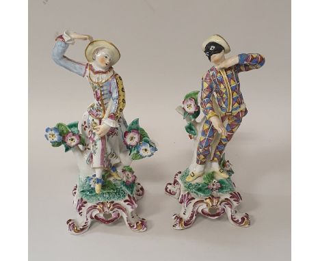 A pair of Bow figures of Harlequin and Columbine on scroll foot bases, bearing paper labels to underside "F.N.L.50" CONDITION