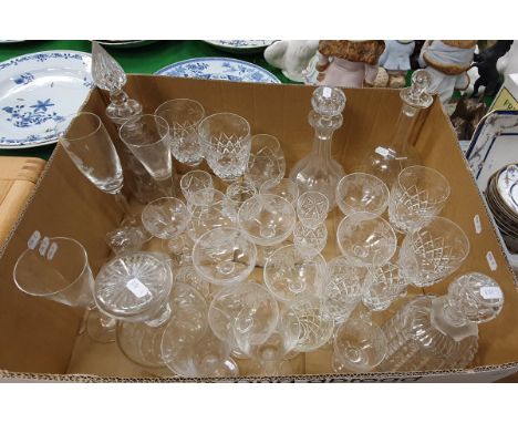 Five various cut glass decanters, together with a selection of mixed drinking glasses to include champagne saucers, champagne