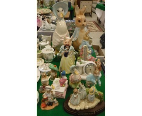 A collection of various Beatrix Potter and other figures including Beswick ware "Mitten", "Tom Kitten" and "Moppet", "Peter R