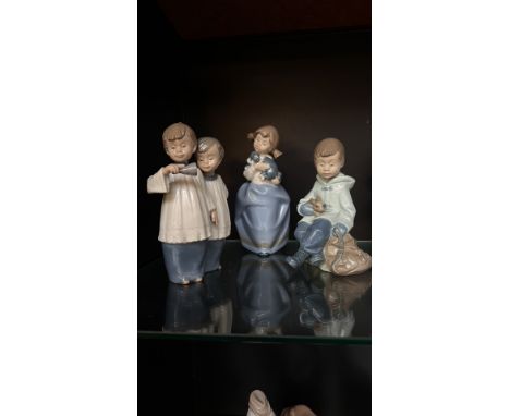 Set of four NAO by Lladro porcelain figurines, made in Spain. The figurines are depictions of children in soft pastel hues.