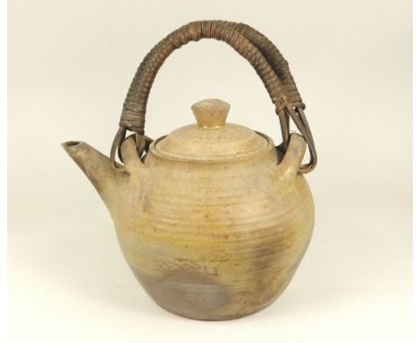 MICHAEL CARDEW. A large Wenford Bridge teapot with double cane handles. Faint fish motif on one side. Personal mark. Width 24
