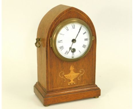 MANTEL CLOCK. A lancet cased mantel clock with inlaid front. Height 22cm.