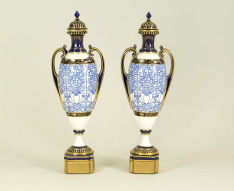 ROYAL WORCESTER. A pair of Royal Worcester vases &amp; covers in the 'Royal Lily' pattern. Each with cork stopper &amp; now f