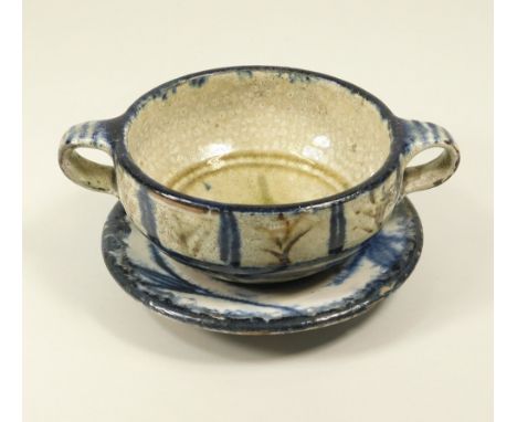 MICHAEL CARDEW. A Wenford Bridge raku-style soup bowl &amp; saucer. Personal marked. Width 18.5cm.