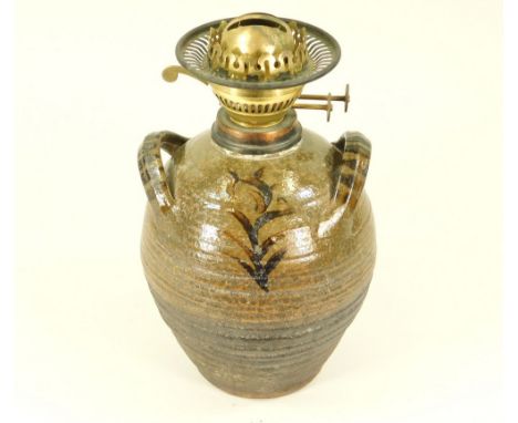 MICHAEL CARDEW. A Winchcombe Pottery twin-handled oil lamp base by Michael Cardew. Personal &amp; Pottery marks. Height 28cm.