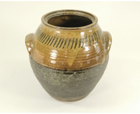 MICHAEL CARDEW. A Winchcombe Pottery twin-handled jar by Michael Cardew. Lacks lid. Personal &amp; Pottery marks. Height 21cm
