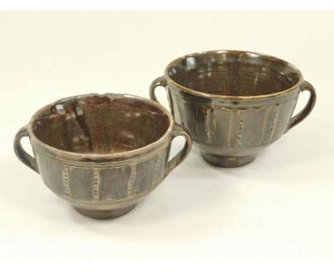 MICHAEL CARDEW. Two twin-handled bowls. Personal &amp; Pottery marks. Diameter 13cm. &amp; 11.5cm. The larger with reference 