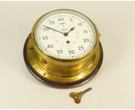 BULKHEAD CLOCK. A Smiths Astral brass bulkhead clock. Dial diameter 18cm.