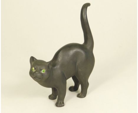 WEDGWOOD.An early 20th century Wedgwood black basalt model of a cat with green glass eyes, modelled by Ernest Light. Height 1