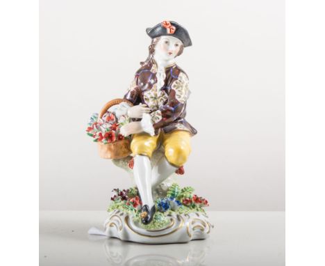 Pair of Sitzendorf porcelain figures, man with a basket of flowers, a lady with a hat, painted in colours on gilt scroll base