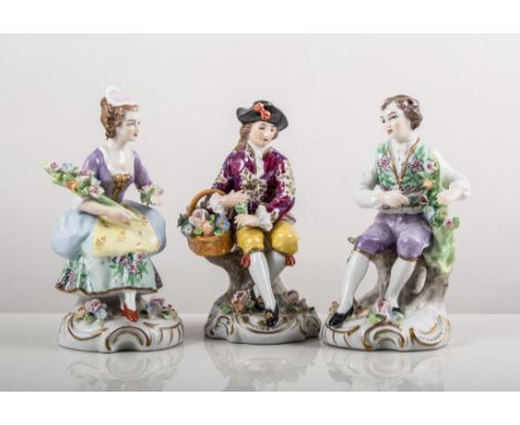 Pair of Sitzendorf models, lady and gentleman with flowers, painted in colours, gilt scroll bases, underglazed blue marks, he