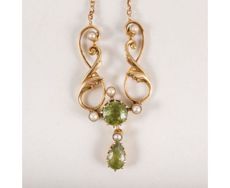 An Edwardian peridot and pearl necklace, a round brilliant cut peridot to centre with pear shape dropper to centre in an all 