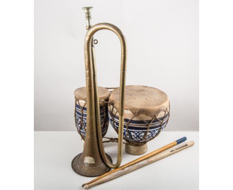 Drum sticks, bugle and ethnic drums.