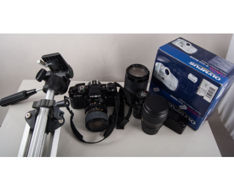 Minolta camera, two lenses and other camera equipment.