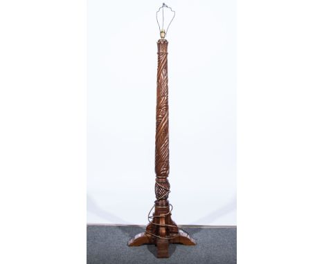 Mahogany standard lamp with carved column of entwined leaves, hobnail base, on four square section supports.