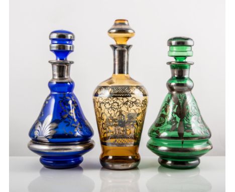 Murano amber-tinted and silver resist liqueur set, including a mallet-shaped decanter, 26cms and two similar sets in green an